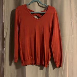 Burnt orange like new sweater size M, super cute open back with cross stitch.
